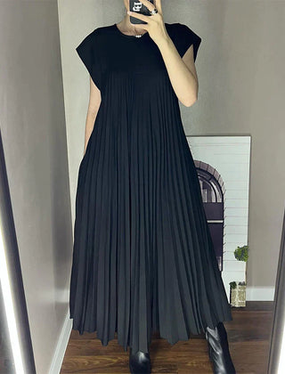 Black sleeveless pleated maxi dress with round neck and flowy tiers