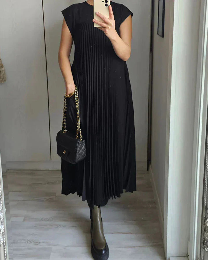 Black sleeveless pleated midi dress with round neck and flowing vertical pleats.