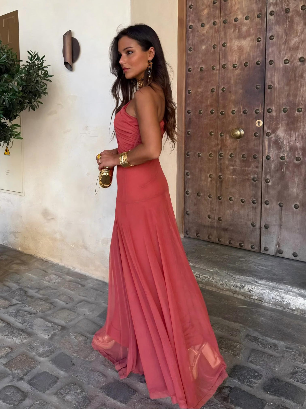 Berry red ruched sleeveless maxi dress with flowing skirt, 3/4 front view