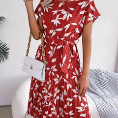 Red floral midi line dress with short flutter sleeves and tied waist