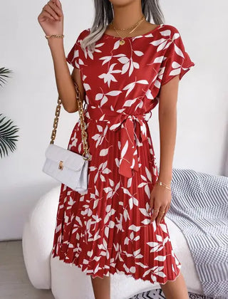 Red floral midi line dress with short flutter sleeves and tied waist