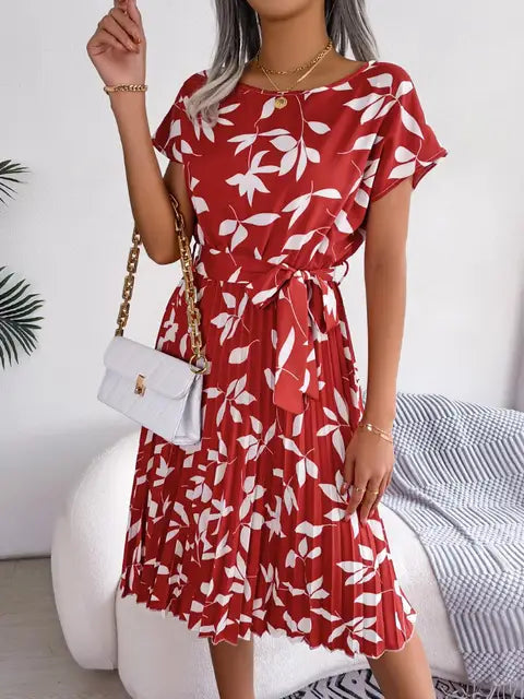 Red floral midi line dress with short flutter sleeves and tied waist