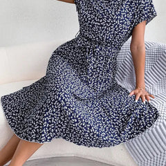 Dark navy floral midi line dress with short sleeves and pleated skirt