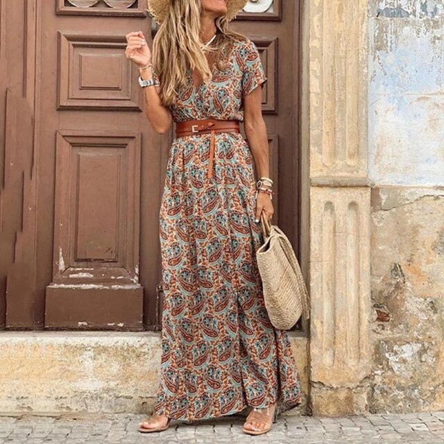 Long Ibiza pleated dress in teal with paisley pattern, short sleeves, and side slit