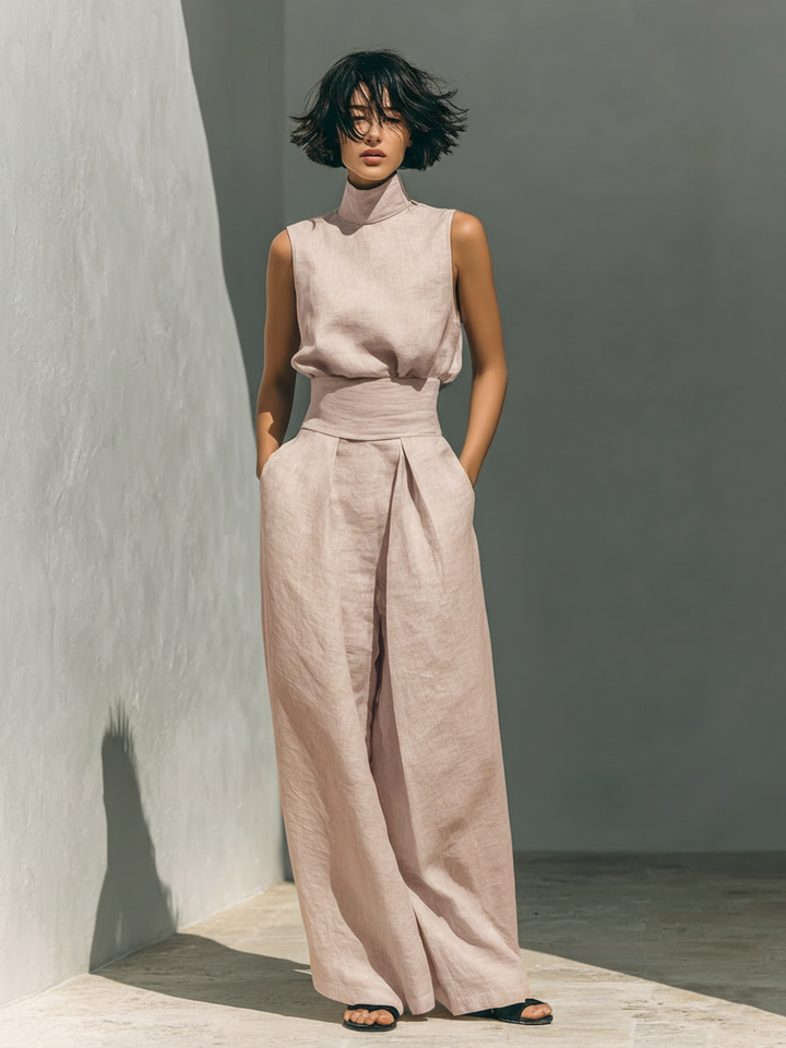 Sleeveless high-neck dress with ruched waist tie and wide legs in light pink