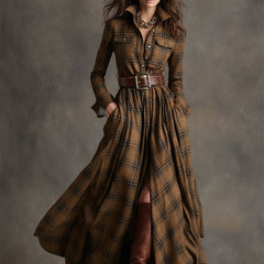 Belted shirt dress in brown plaid with long sleeves, button-front, and full skirt