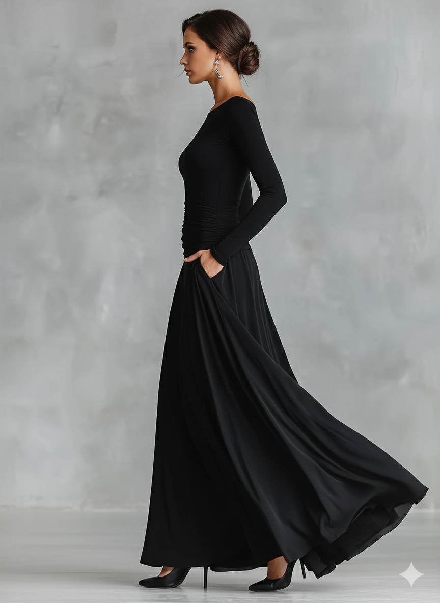 Black long-sleeve maxi dress, side view, flowing A-line skirt and ruched bodice