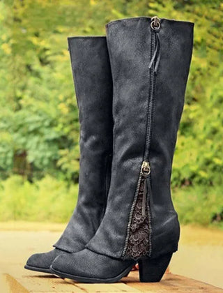 Black knee-high boots with side zipper and lace-trimmed front panel