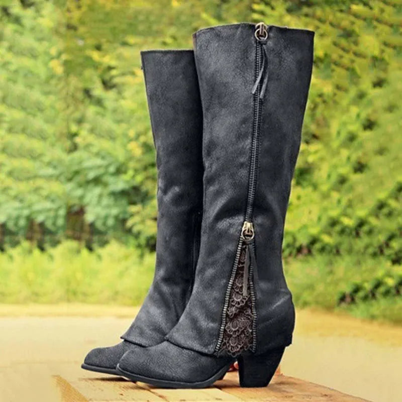 Black knee-high boots with side zipper and lace-trimmed front panel