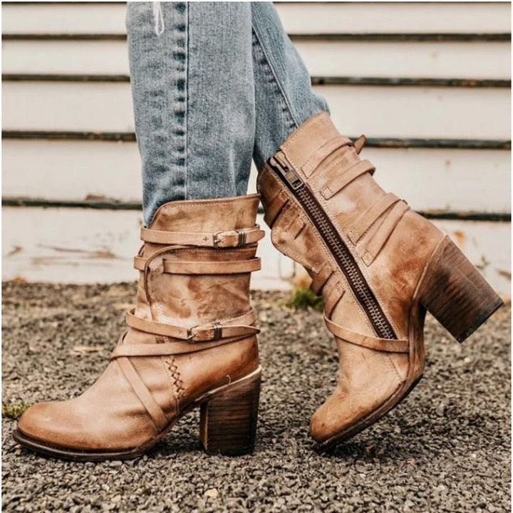 Brown slouchy leather ankle boots with buckle straps, side zipper, and block heel