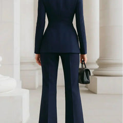 Navy blazer and wide-leg palazzo pants set, fitted back with long sleeves.