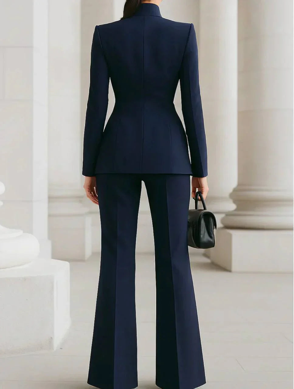 Navy blazer and wide-leg palazzo pants set, fitted back with long sleeves.