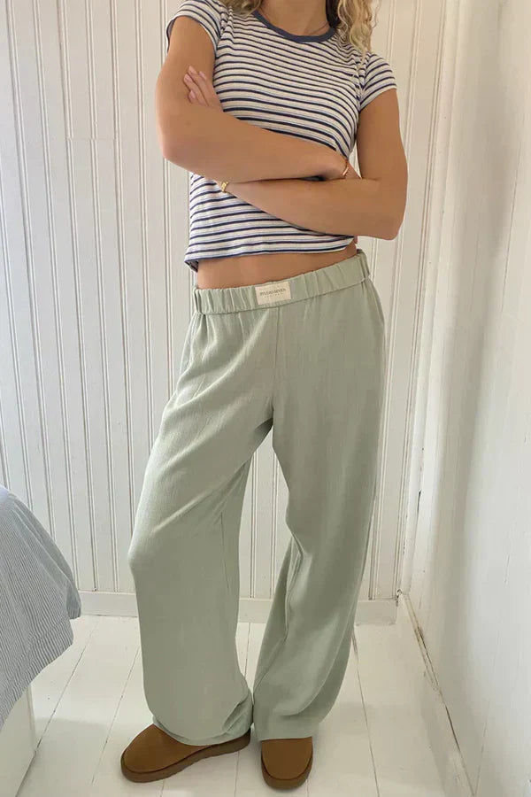 Sage green lounge trousers with elastic drawstring waist, relaxed wide legs