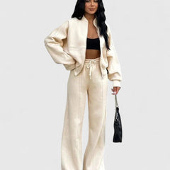 Zip-up sweater and drawstring pants set in cream, long sleeves with drawstring waist.