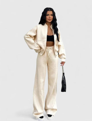Zip-up sweater and drawstring pants set in cream, long sleeves with drawstring waist.