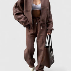 Zip-up sweater and drawstring pants set in mauve-brown with relaxed fit and side pockets.