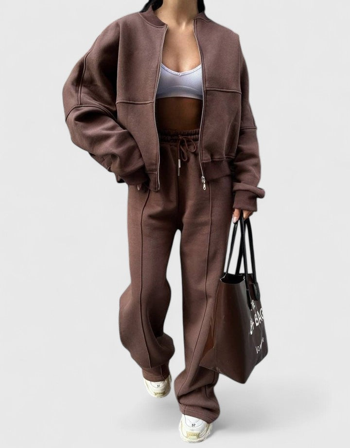 Zip-up sweater and drawstring pants set in mauve-brown with relaxed fit and side pockets.