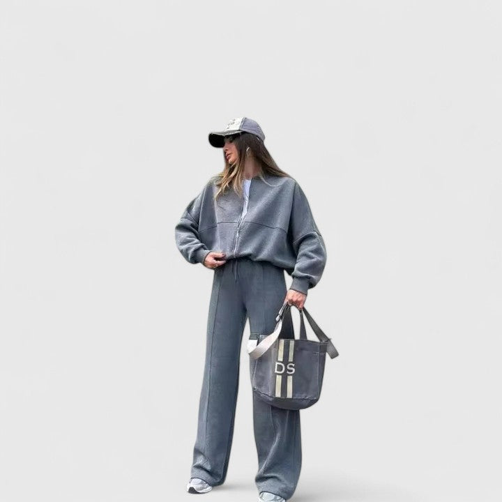 Zip-up sweater and drawstring pants set in medium blue-gray, relaxed fit with pockets.