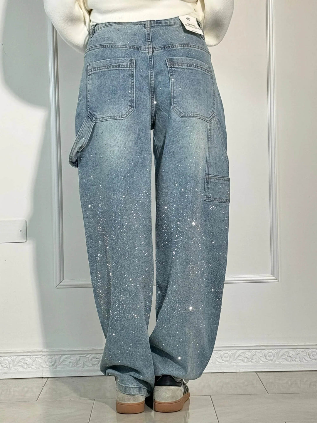 Light blue speckled wide-leg denim trousers with stitched front pockets and back yoke