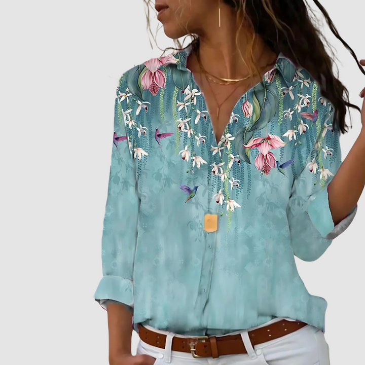 Soft blouse in light teal with tropical bird-and-flower print, button-up front