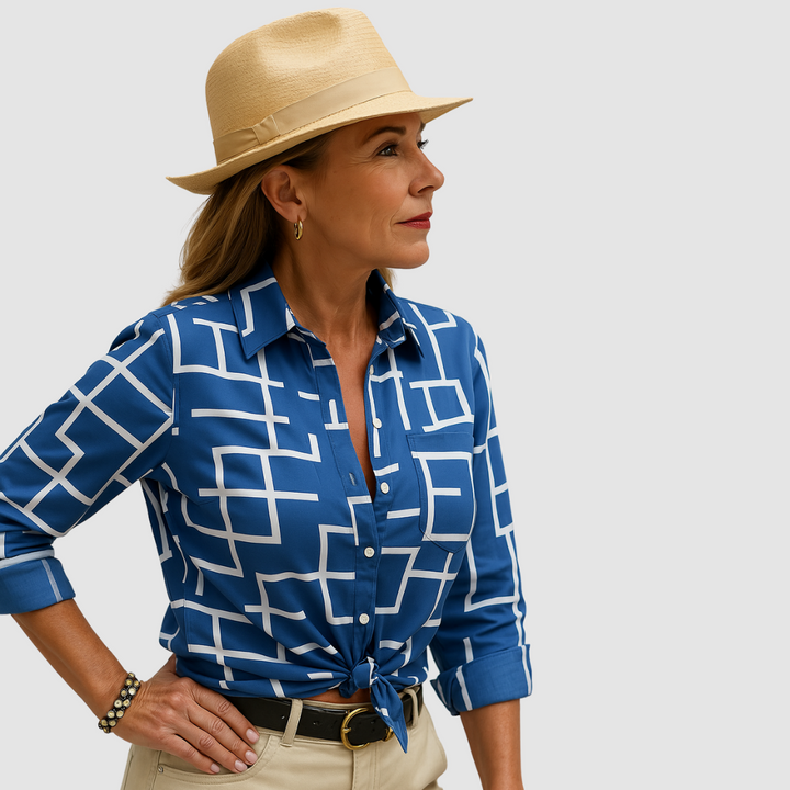 Ocean blue button-up blouse with white geometric grid pattern and long sleeves