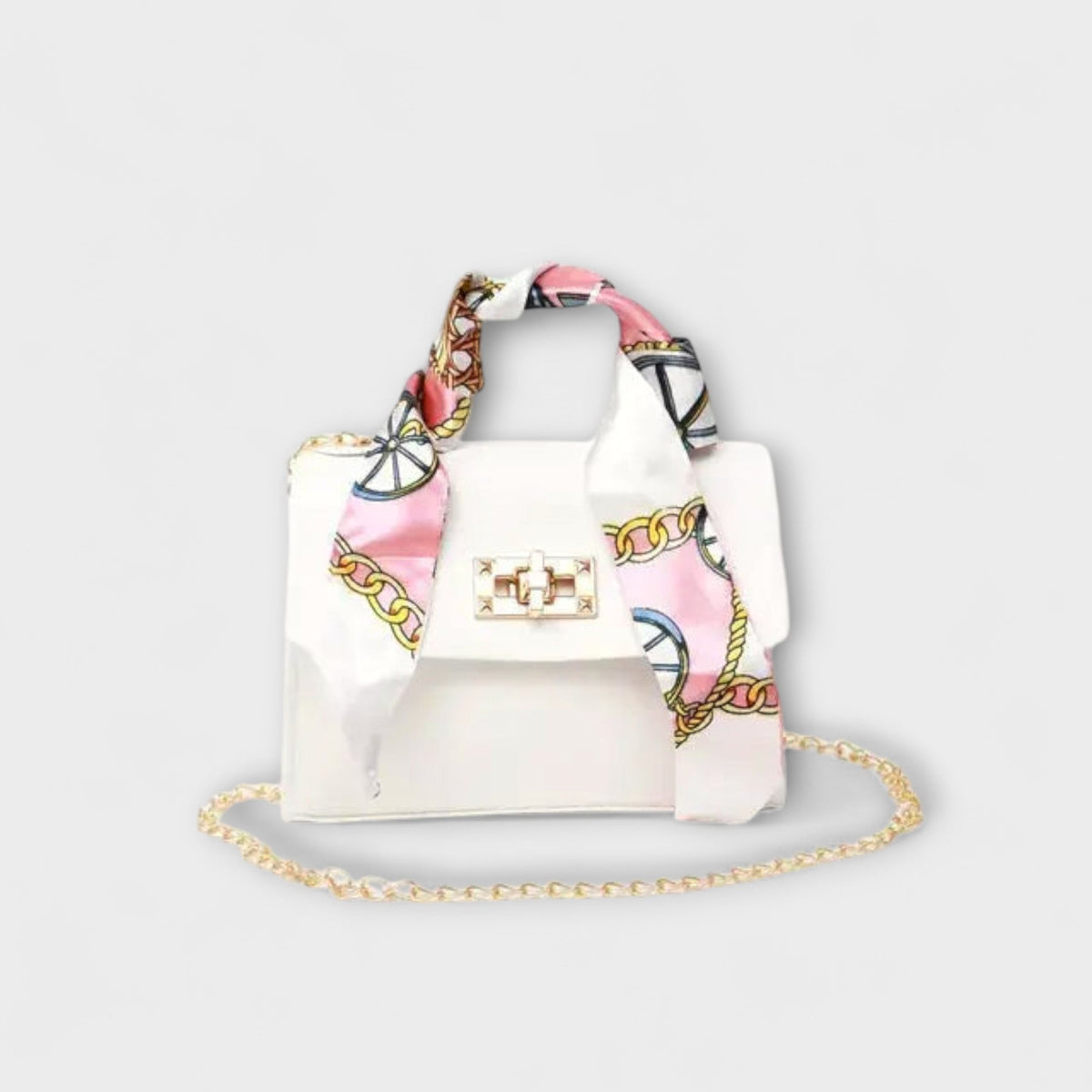 White handbag with gold clasp, chain strap, and light patterned scarf handles