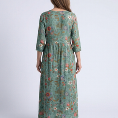 Floral v-neck maxi dress back view, teal-green with three-quarter sleeves