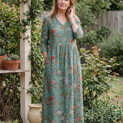 Teal-green floral maxi dress with v-neck and three-quarter sleeves