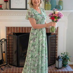 Green floral chiffon maxi dress with V-neck and short sleeves, tiered silhouette.