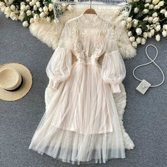 Beige lace and tulle long-sleeve dress with puff sleeves and layered skirt