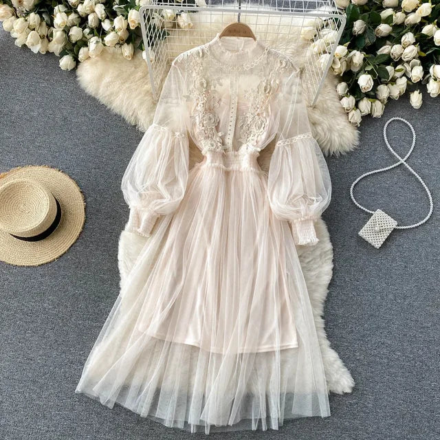 Beige lace and tulle long-sleeve dress with puff sleeves and layered skirt