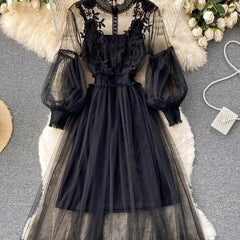 Black lace tulle long-sleeve dress with puff sleeves and tiered net skirt