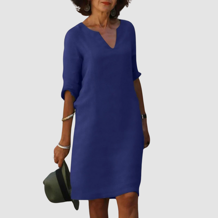 Navy blue V-neck shift dress with 3/4 sleeves, knee length.
