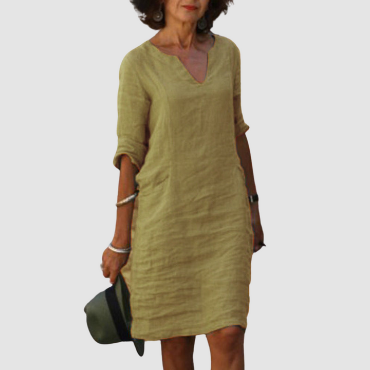 Khaki V-neck shift dress with 3/4 sleeves, knee length.