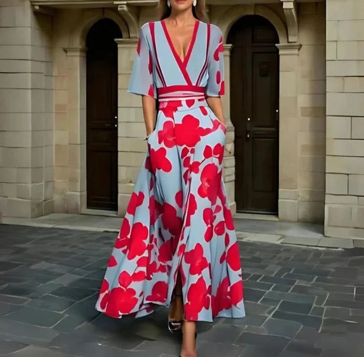 Floral midi dress with V-neck, short sleeves, red belt, light blue base and red blooms