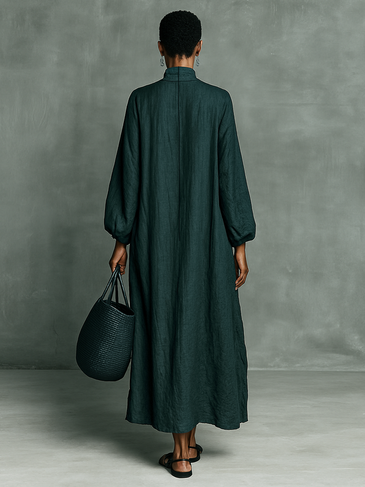 Back view teal maxi dress with high neck and loose A-line silhouette