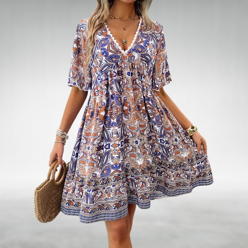 Blue paisley elegant dress with V-neck, short flutter sleeves, gathered tiered skirt