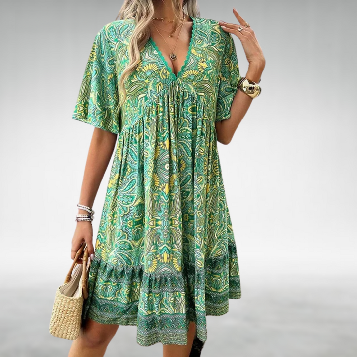Green paisley elegant dress with V-neck, short flutter sleeves, gathered tiered skirt