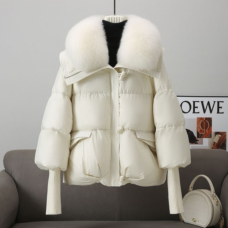 White puffer jacket with faux fur collar, front zipper, flap pockets, ribbed knit cuffs