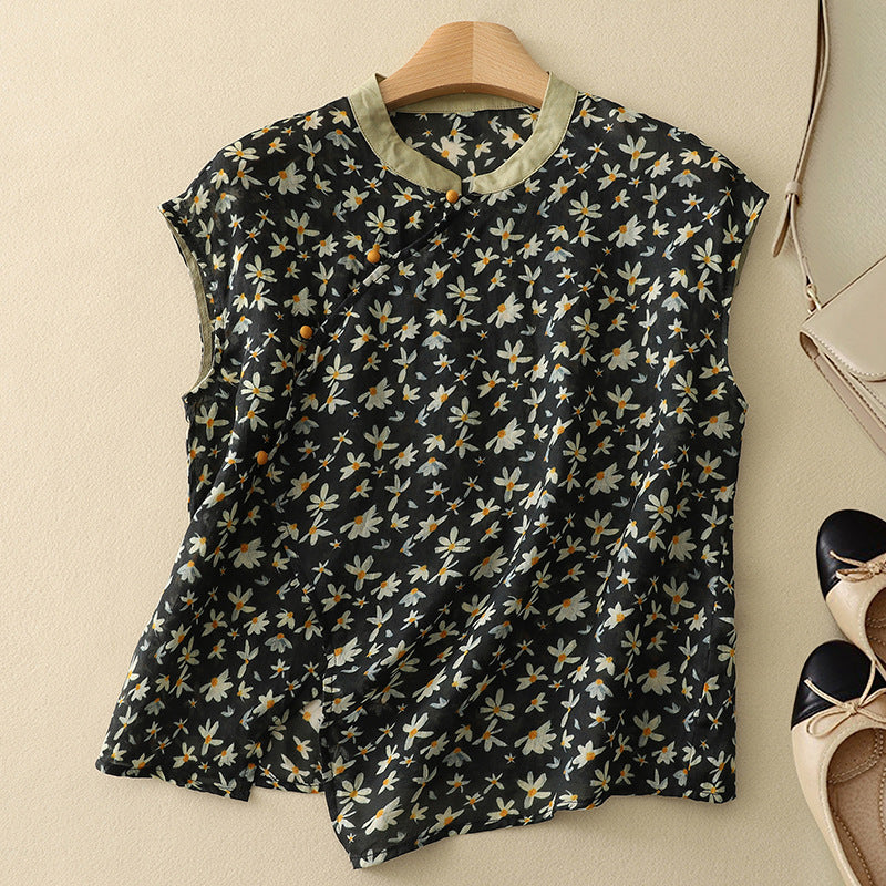 Black linen sleeveless top with small yellow daisy pattern and button-front placket