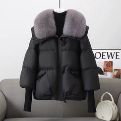 Black puffer jacket with faux fur collar, front zipper, flap pockets, ribbed knit cuffs