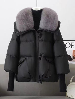 Black puffer jacket with faux fur collar, front zipper, flap pockets, ribbed knit cuffs