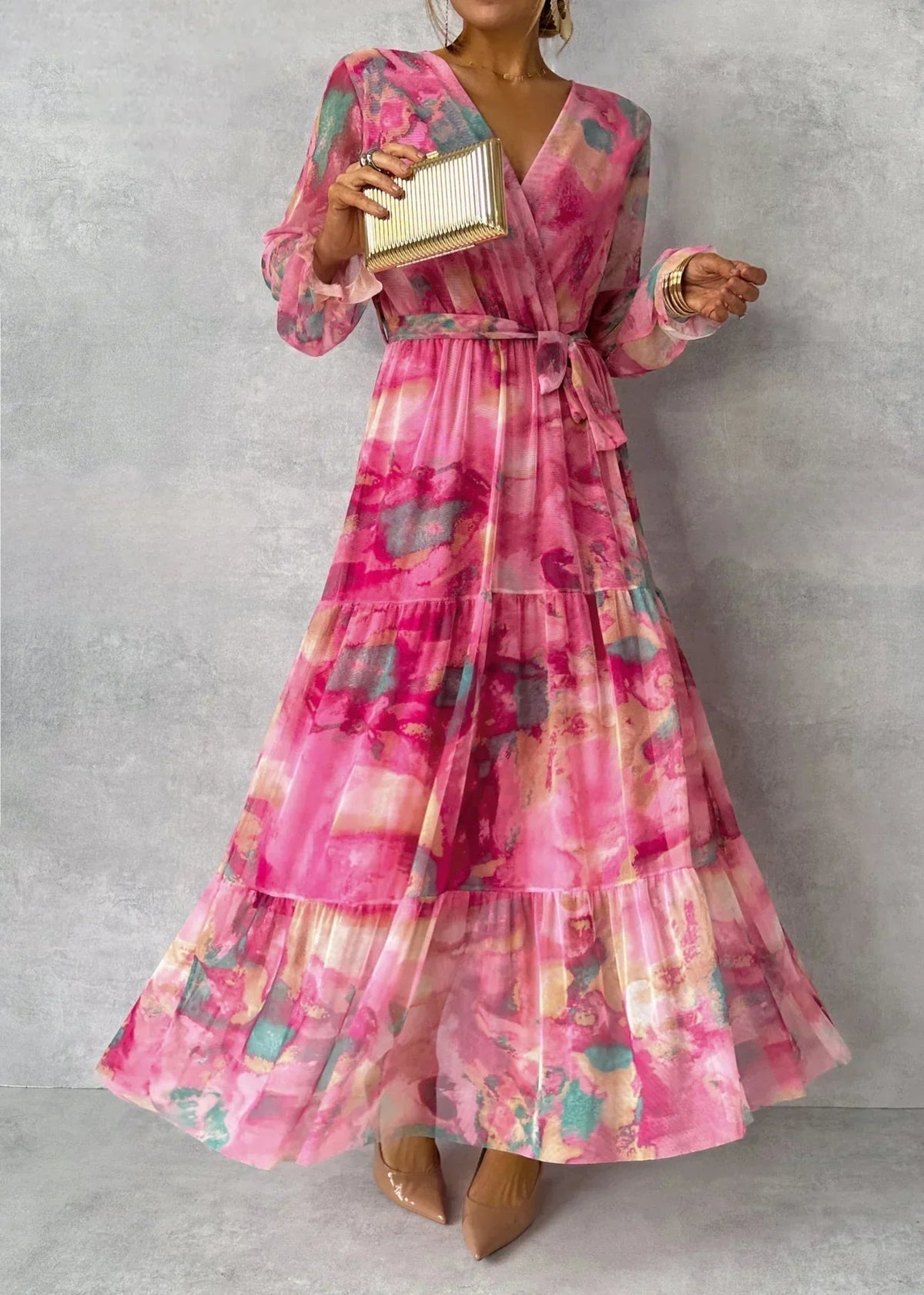 Floral tiered maxi dress with pink V-neck and long ruffle sleeves, belted waist