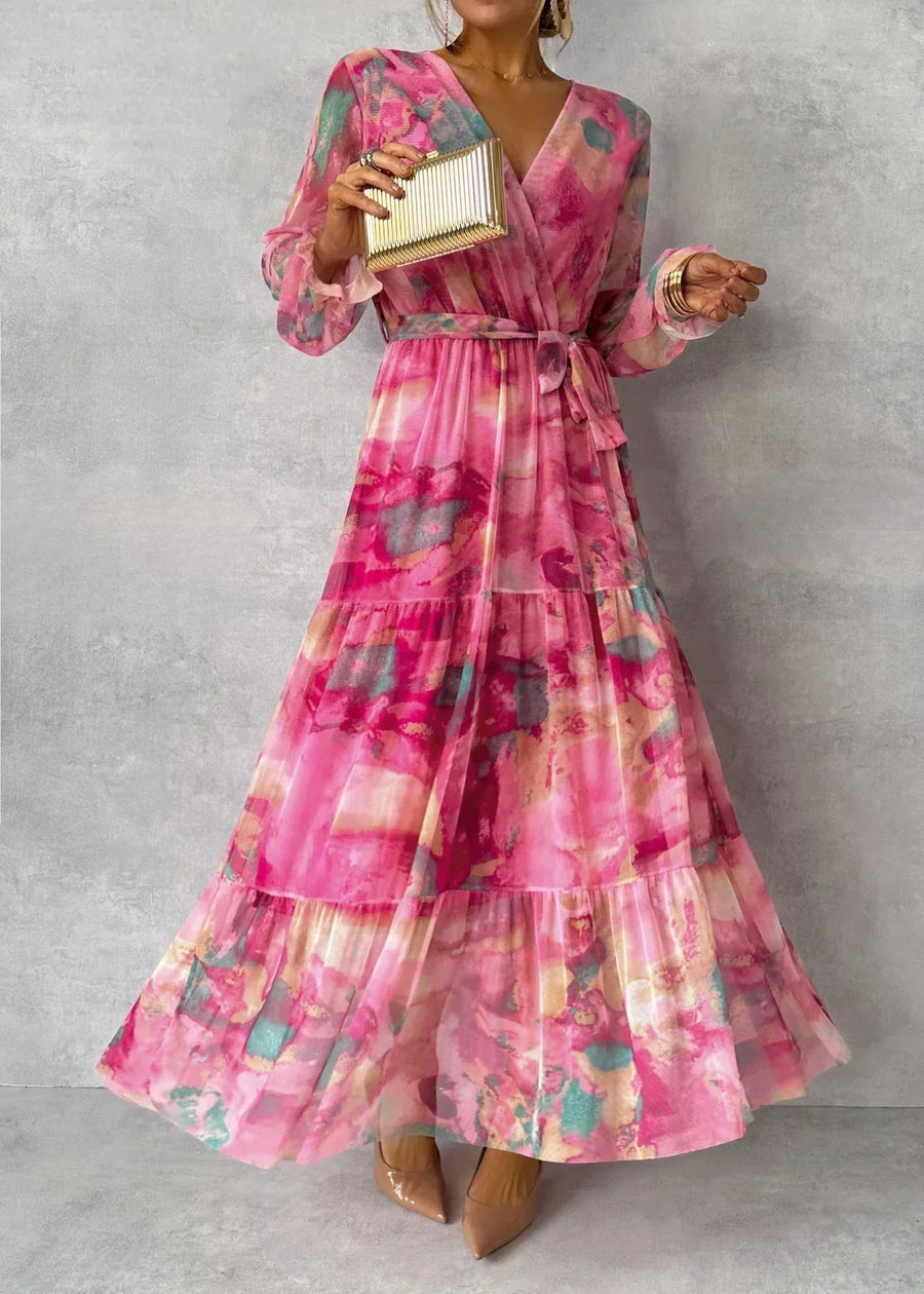 Floral tiered maxi dress with pink V-neck and long ruffle sleeves, belted waist