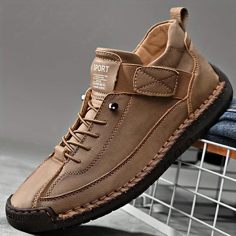 Brown comfort support sneaker with lace-up front, side strap, and dark textured outsole