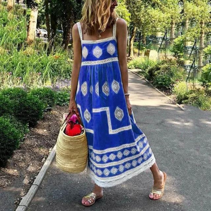Sleeveless vintage dress in blue with white diamond medallion print and tiered hem