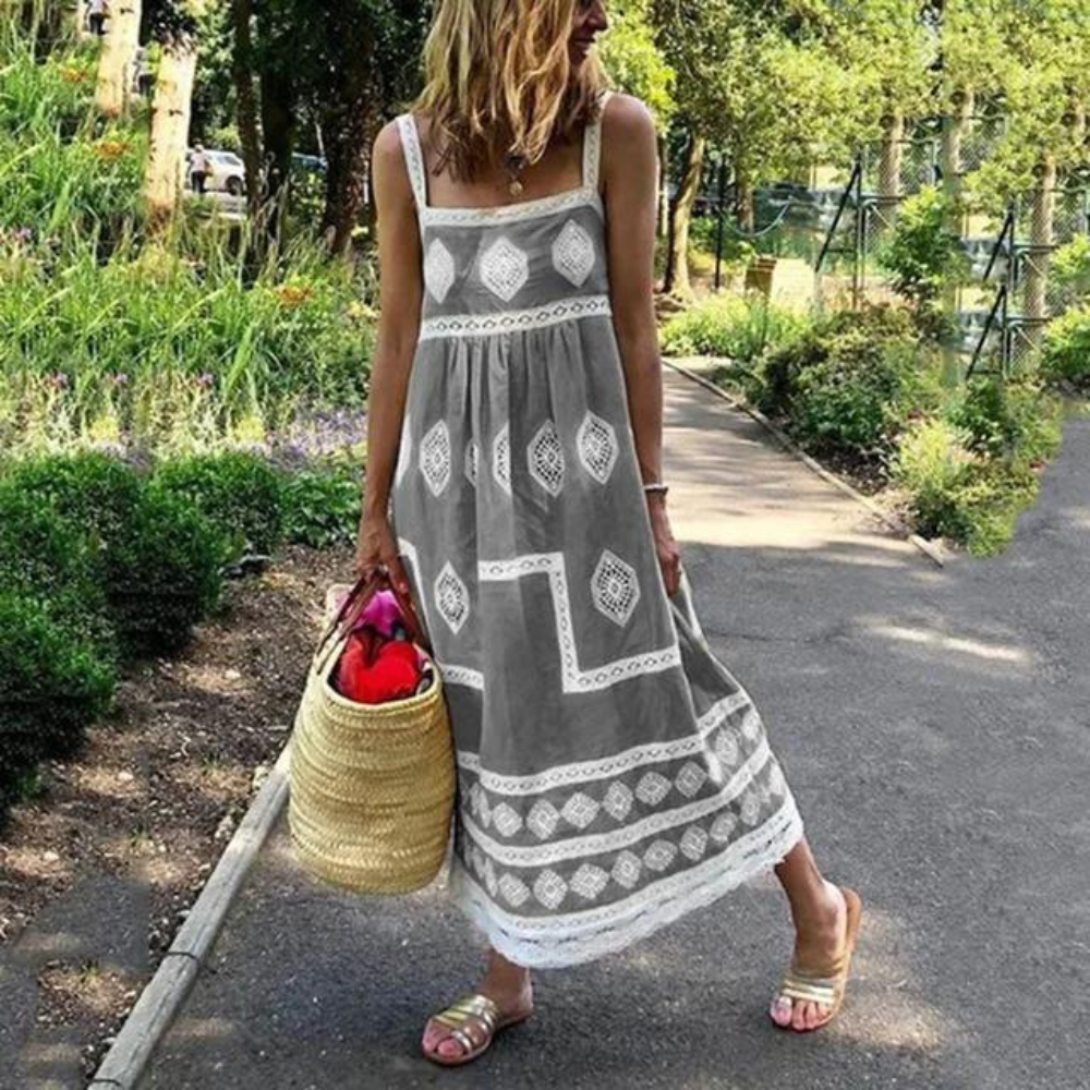 Sleeveless vintage dress in gray with white diamond medallion print and tiered hem