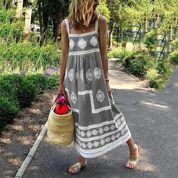 Sleeveless vintage dress in gray with white diamond medallion print and tiered hem