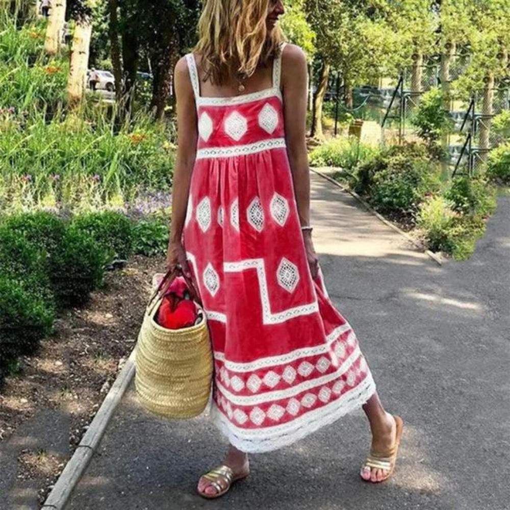 Sleeveless vintage dress in red with white diamond medallion print and tiered hem