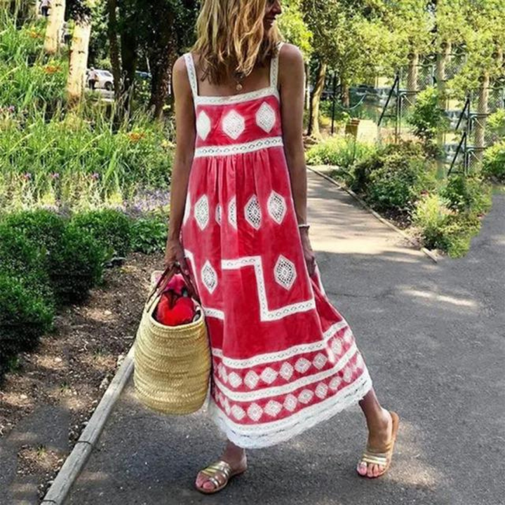 Sleeveless vintage dress in red with white diamond medallion print and tiered hem